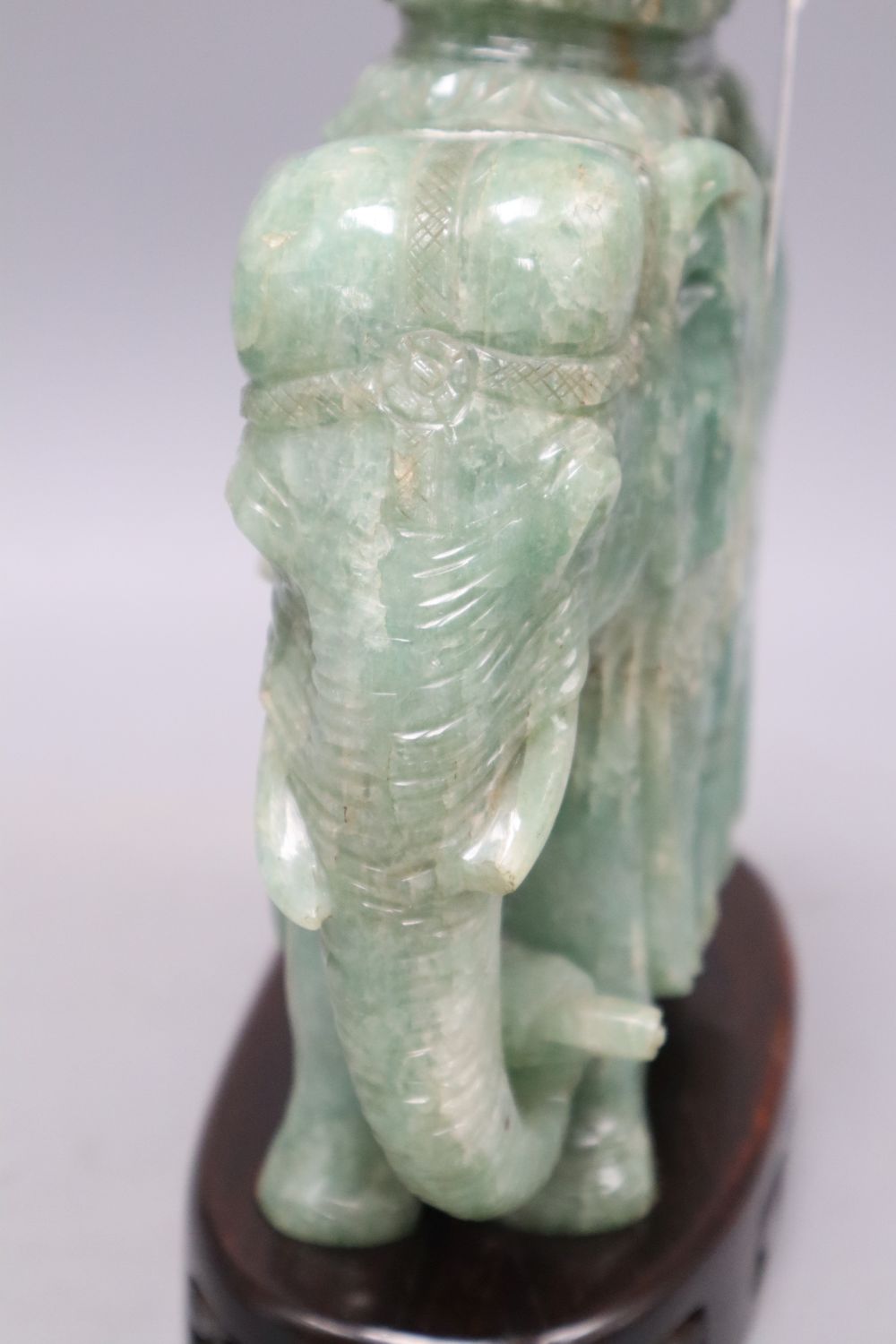 A large Chinese stone carving of elephant, with wood stand, overall 26cm